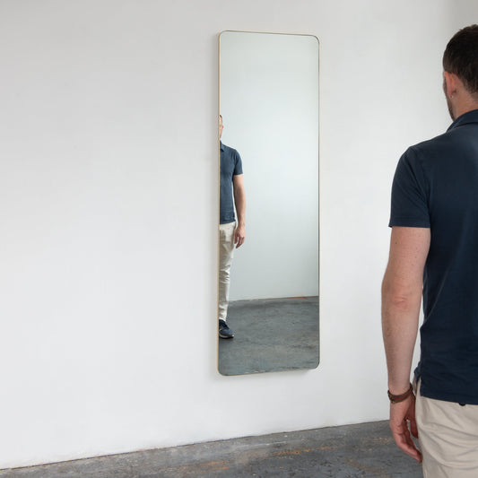 NEW Oversized Quadris™ Wall leaning and Wall Hanging Mirror with a Brushed Brass Frame