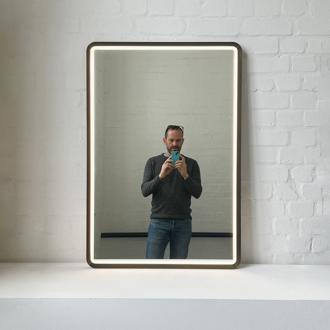 New Quadris™ Front Illuminated Rectangular Mirror with Bronze Patina Mitred Frame