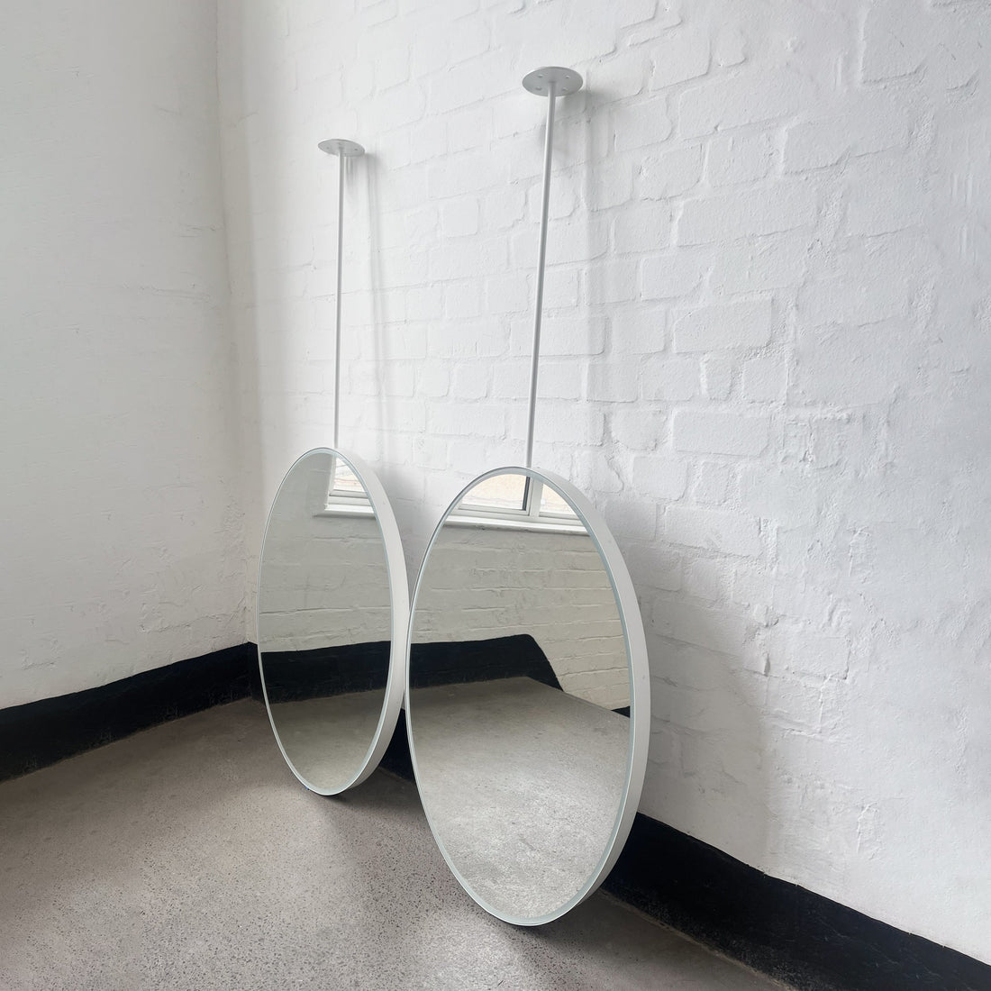 Set of Two Ceiling-Suspended Ovalis™ Mirrors with a White Frame