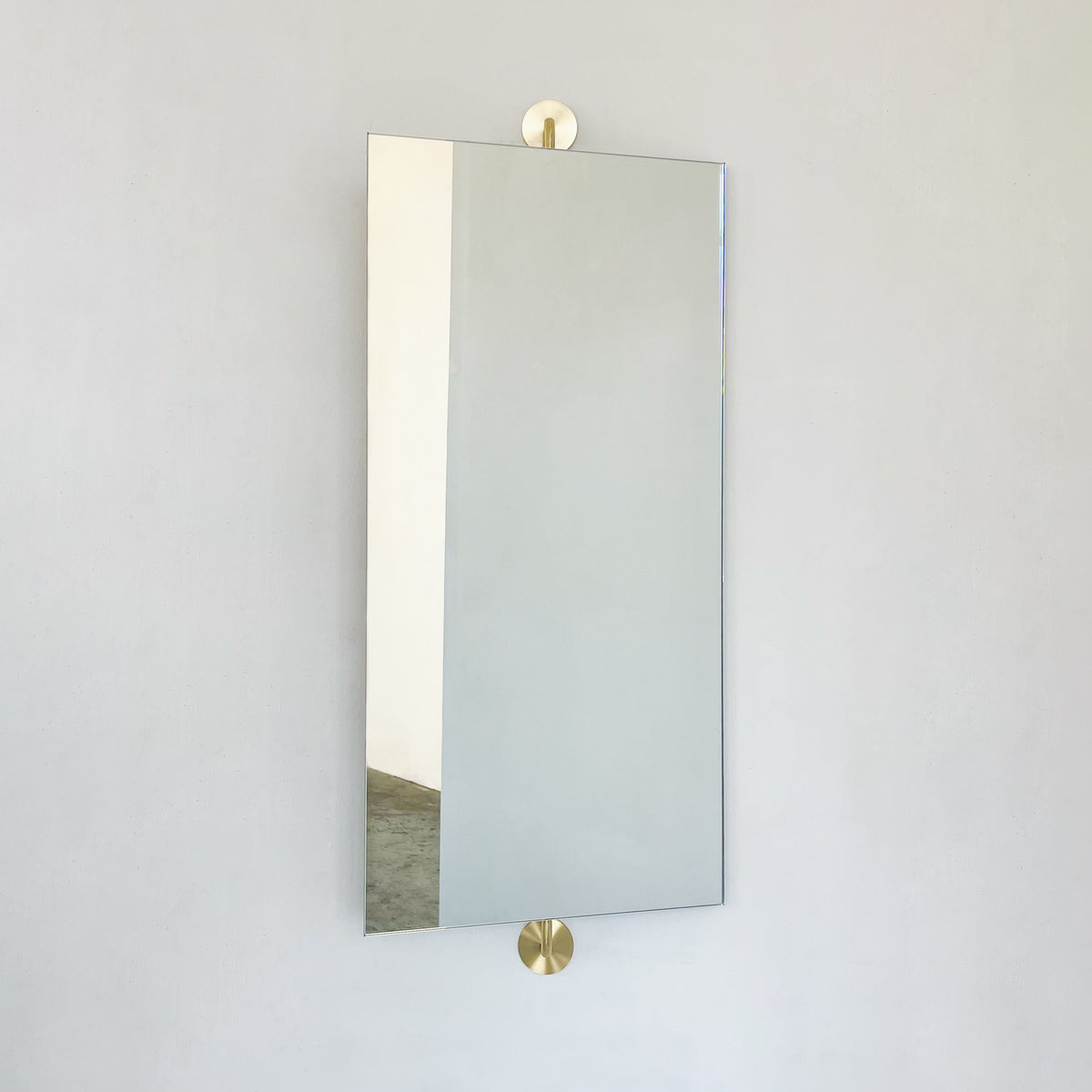 Wall Attached Rotating Rectangular Mirror with Brushed Brass Backing