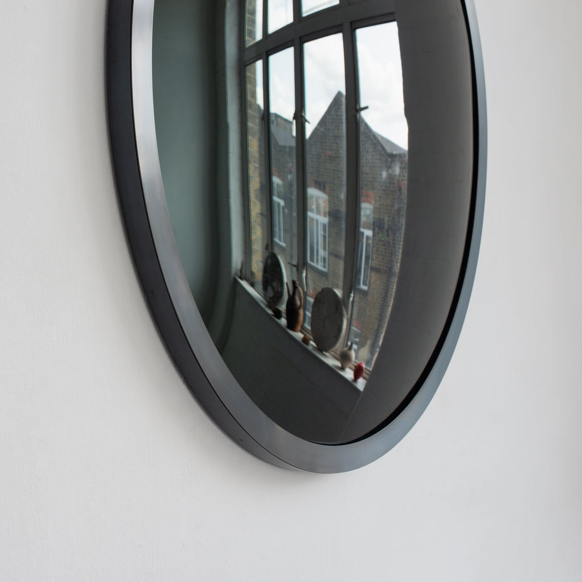 In Stock Orbis™ Round Black Convex Handcrafted Mirror with Blackened Metal Frame