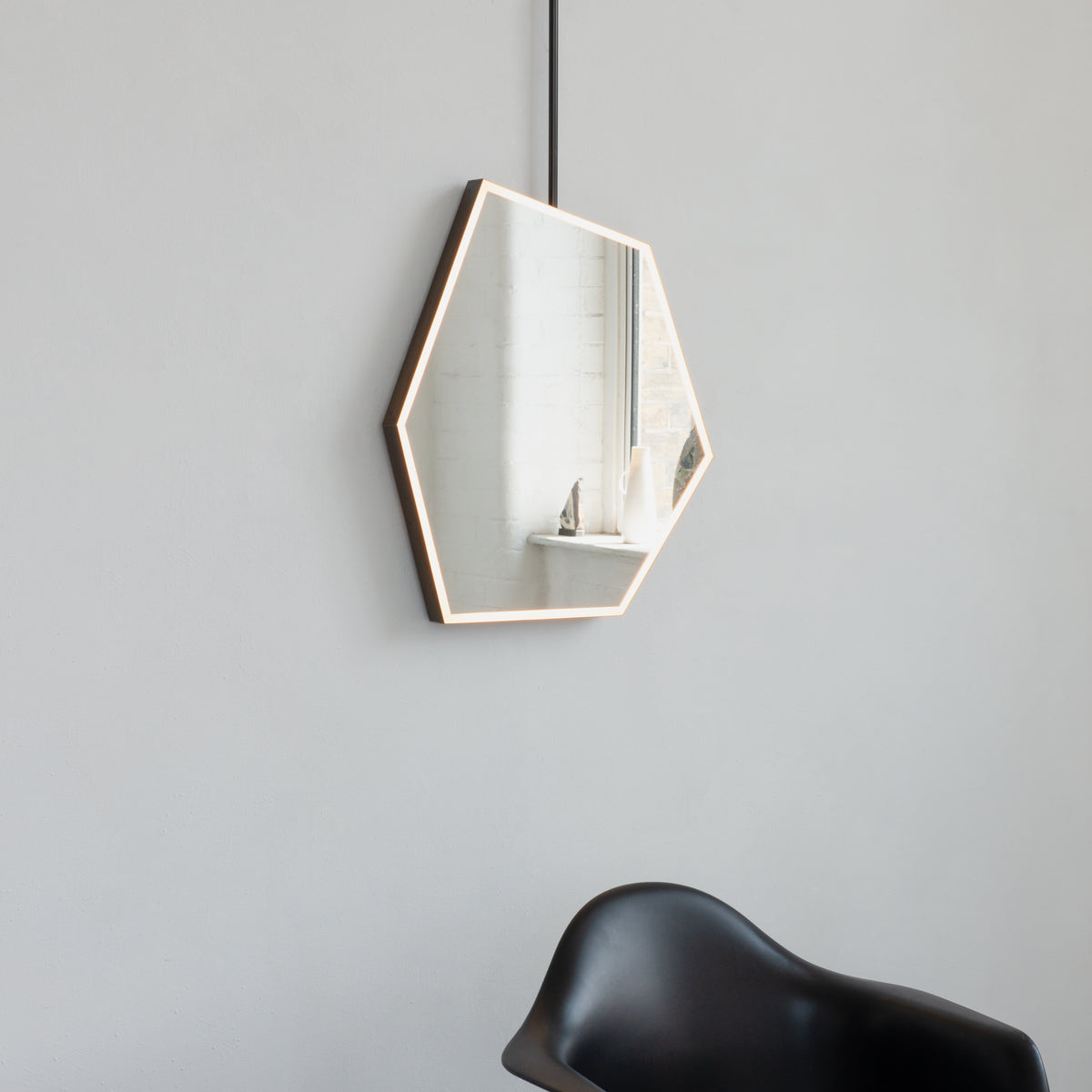 Ceiling Suspended Front Illuminated Irregular Hexagon Mirror with Minimalist Bronze Patina Frame and ON / OFF Sensor Switch