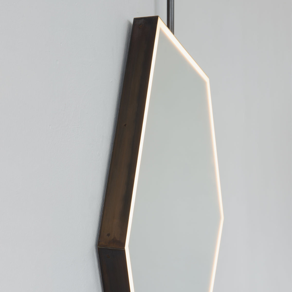 Ceiling Suspended Front Illuminated Irregular Hexagon Mirror with Minimalist Bronze Patina Frame and ON / OFF Sensor Switch