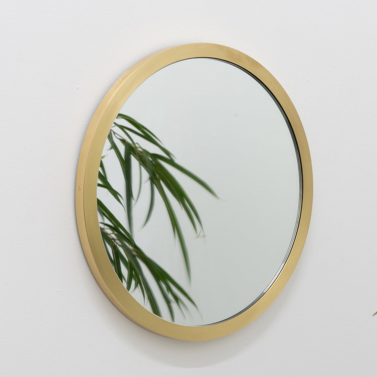 Orbis™ Round Mirror with a Handcrafted Brass Full Frame