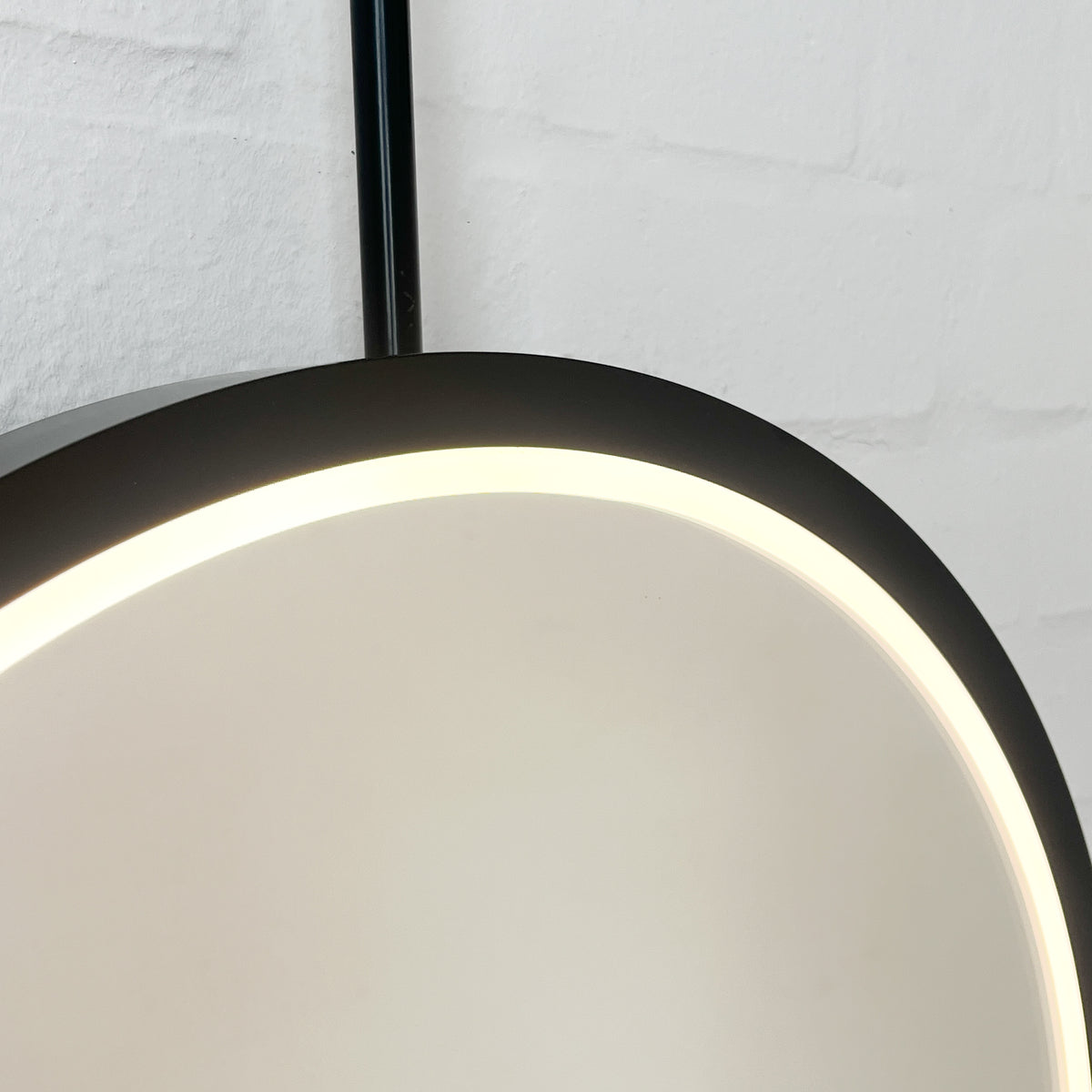 Capsula™ Ceiling-Suspended Illuminated Mirror with Contemporary Black Full Frame