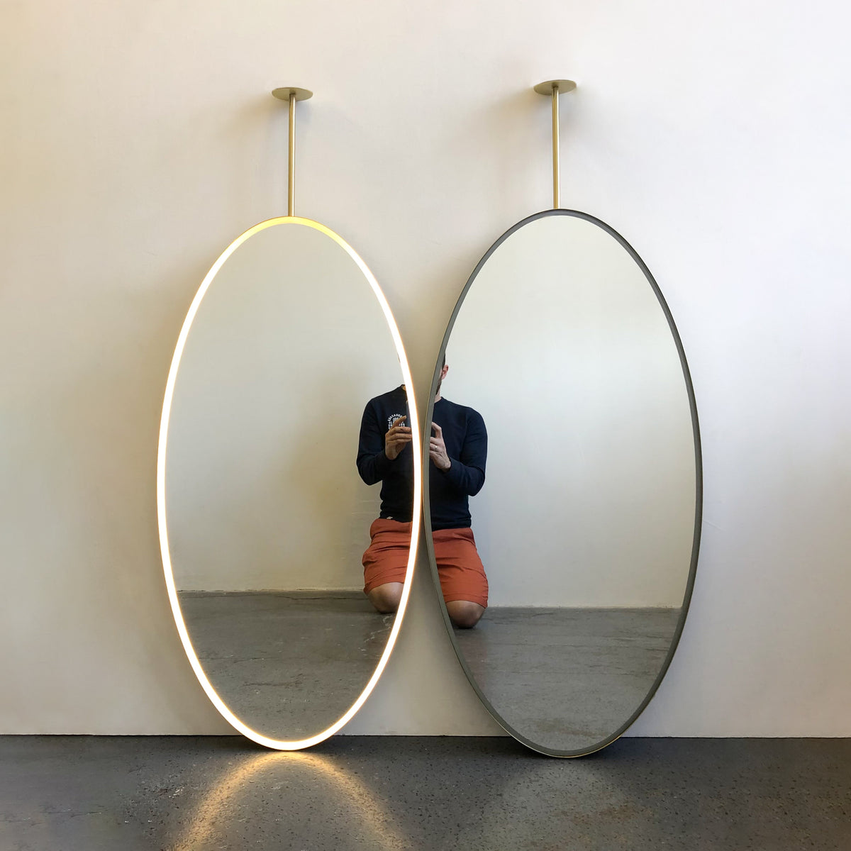  Illuminated Ceiling Suspended Contemporary Oval Mirror with a Brass Frame