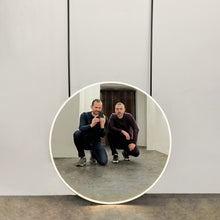 Modern Orbis™ Illuminated Ceiling Suspended Round Mirror with Black Frame