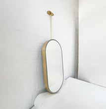 Capsula™ Ceiling Suspended Contemporary Mirror with a Brass Frame and Front Illumination