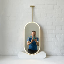 Capsula™ Ceiling Suspended Contemporary Mirror with a Brass Frame and Front Illumination