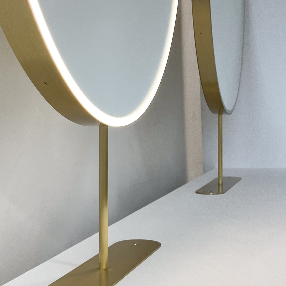 Set of Two Orbis™ Modern Countertop Round Illuminated Bathroom Mirrors with Brass Frame