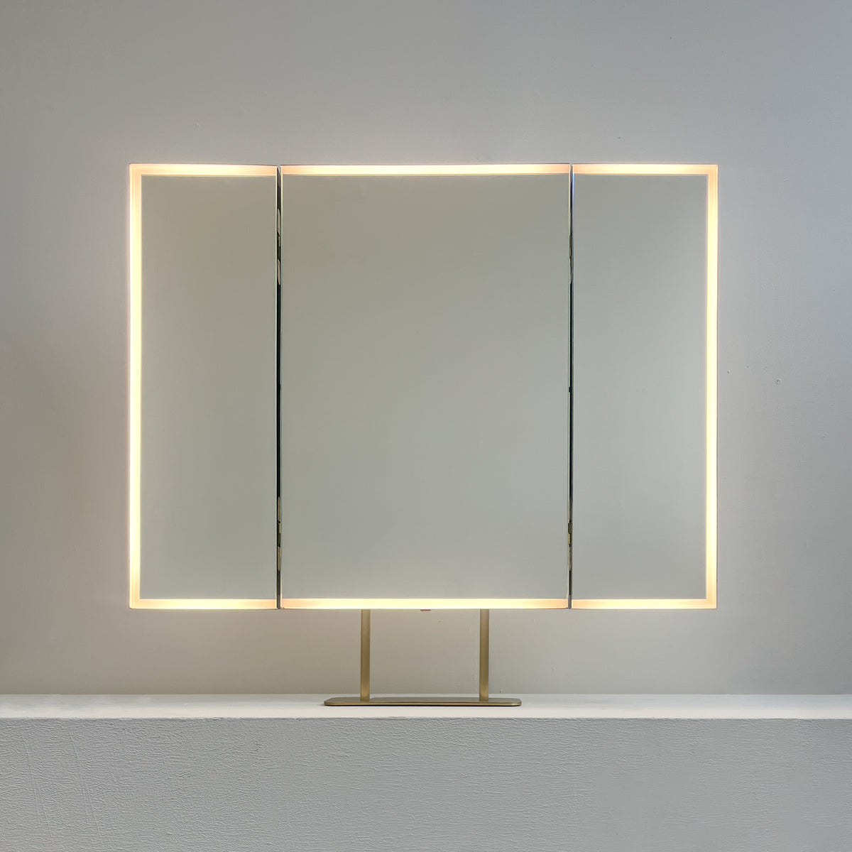 Illuminated Triptych Countertop Mirror with Brushed Brass Frame