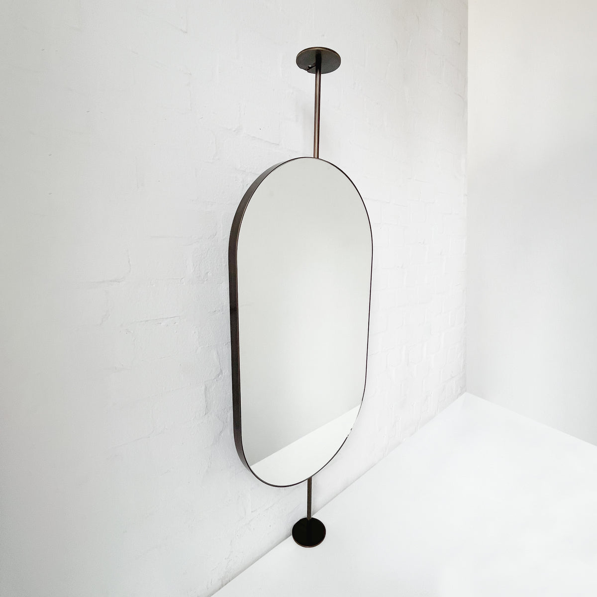 Countertop-to-Ceiling Capsula™ Mirror with Bronze Patina Brass Frame