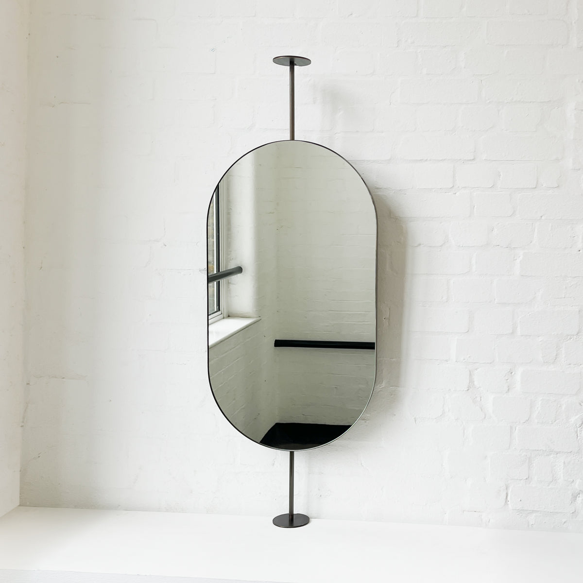 Countertop-to-Ceiling Capsula™ Mirror with Bronze Patina Brass Frame