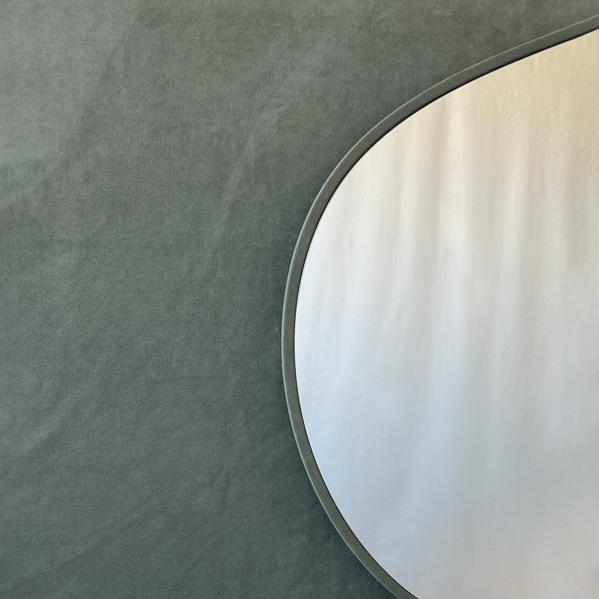 Freeform Irregular Mirror with Grey Suede Fabric Frame
