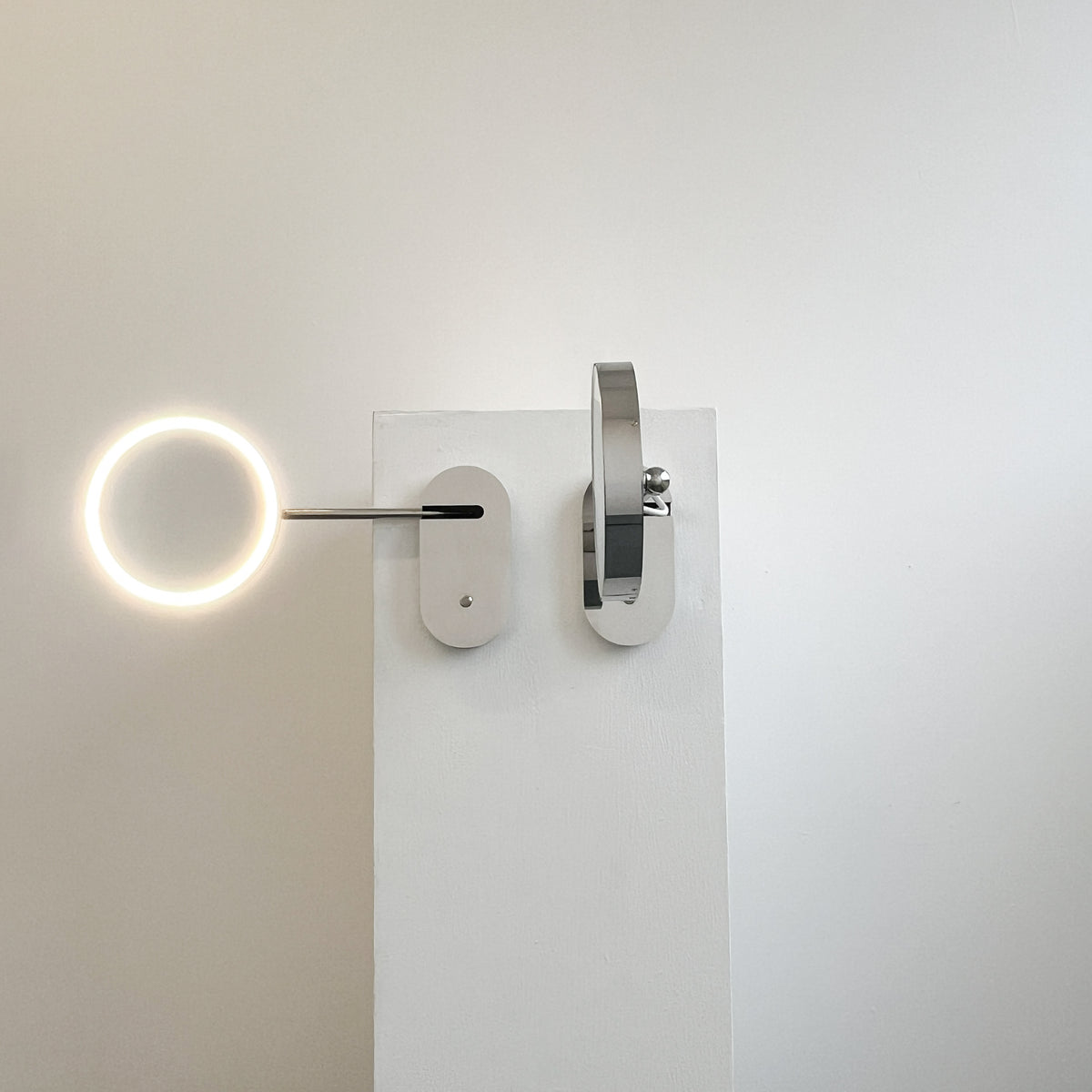 Illuminated Wall-Attached Magnifying Mirror with Brass Frame and Collapsible Arm