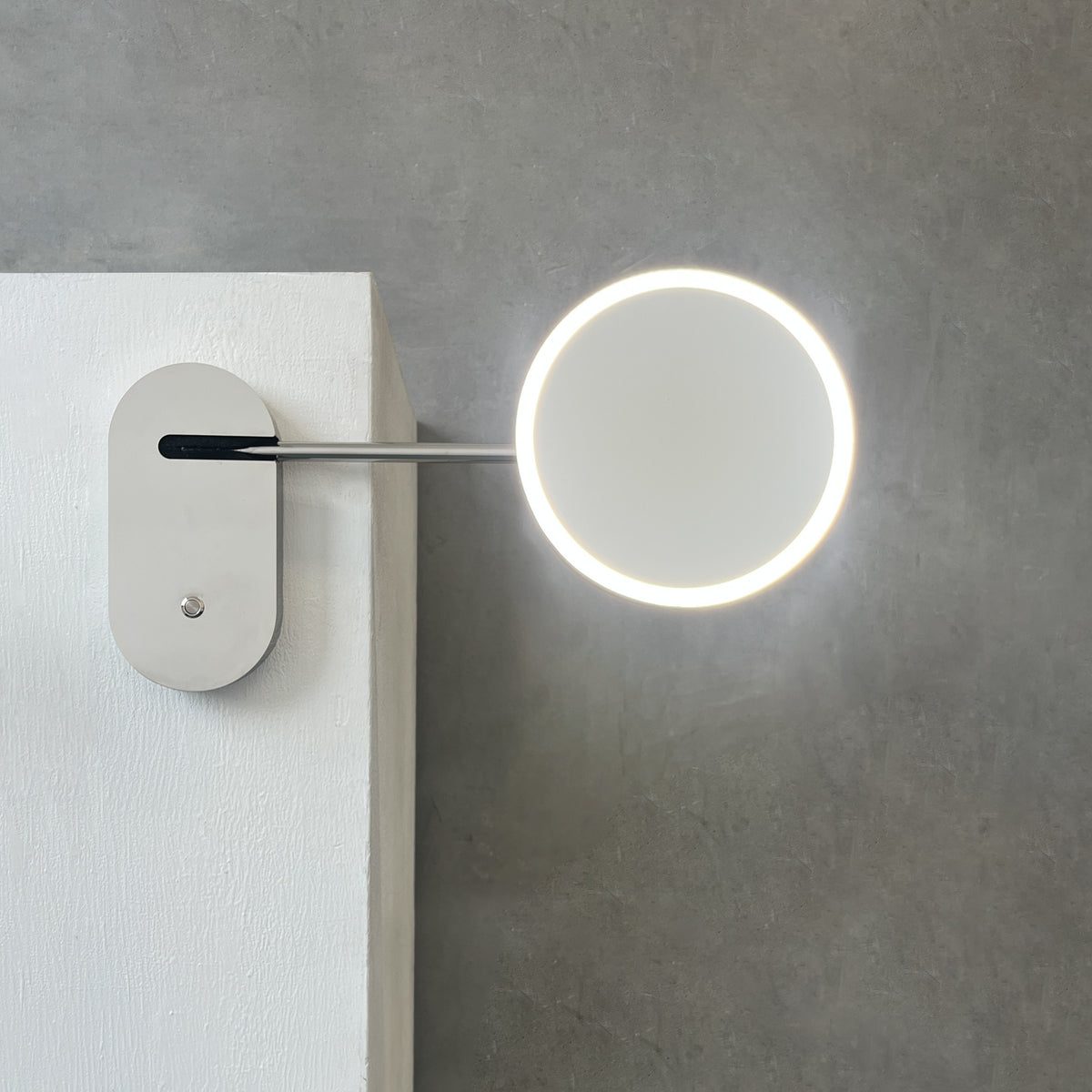 Illuminated Wall-Attached Magnifying Mirror with Brass Frame and Collapsible Arm