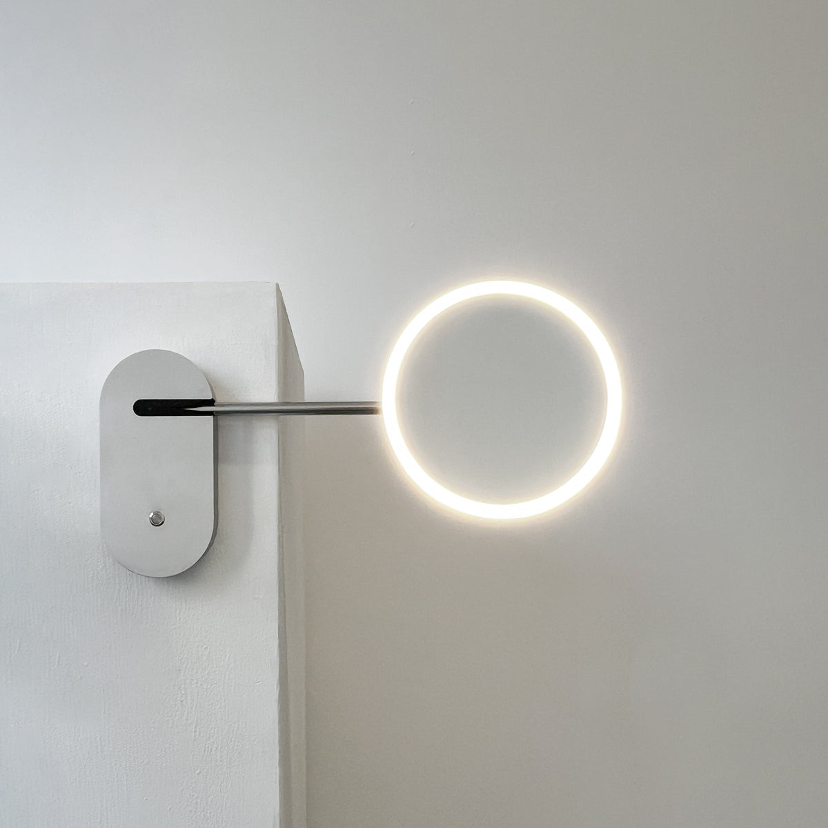 Illuminated Wall-Attached Magnifying Mirror with Brass Frame and Collapsible Arm