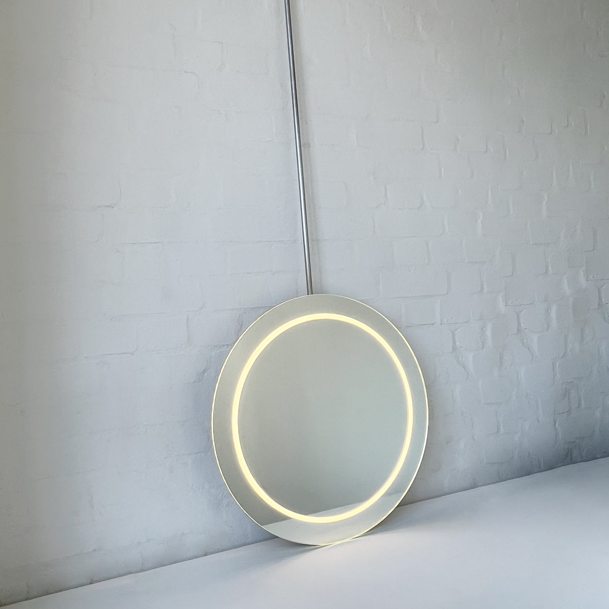 NEW Orbis™ Ceiling-Suspended Illuminated Round Frameless Mirror