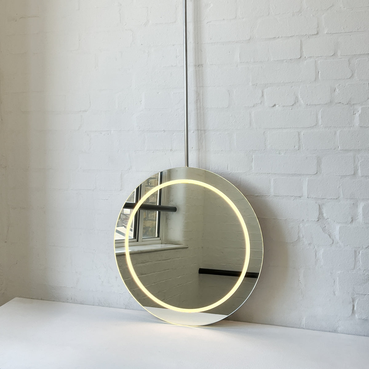 NEW Orbis™ Ceiling-Suspended Illuminated Round Frameless Mirror