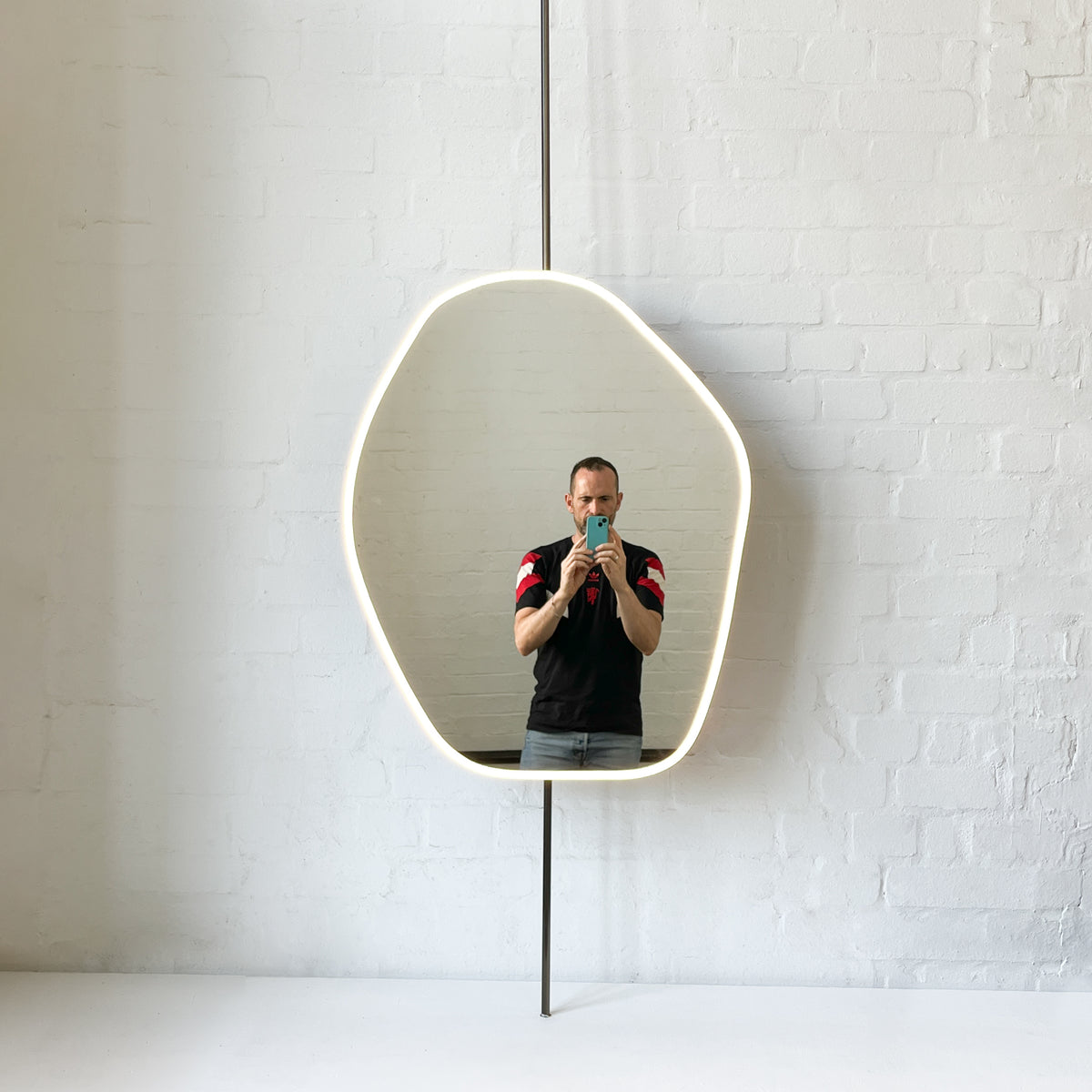 Countertop to Ceiling Freeform Illuminated Mirror with Bronze Patina Brass Frame