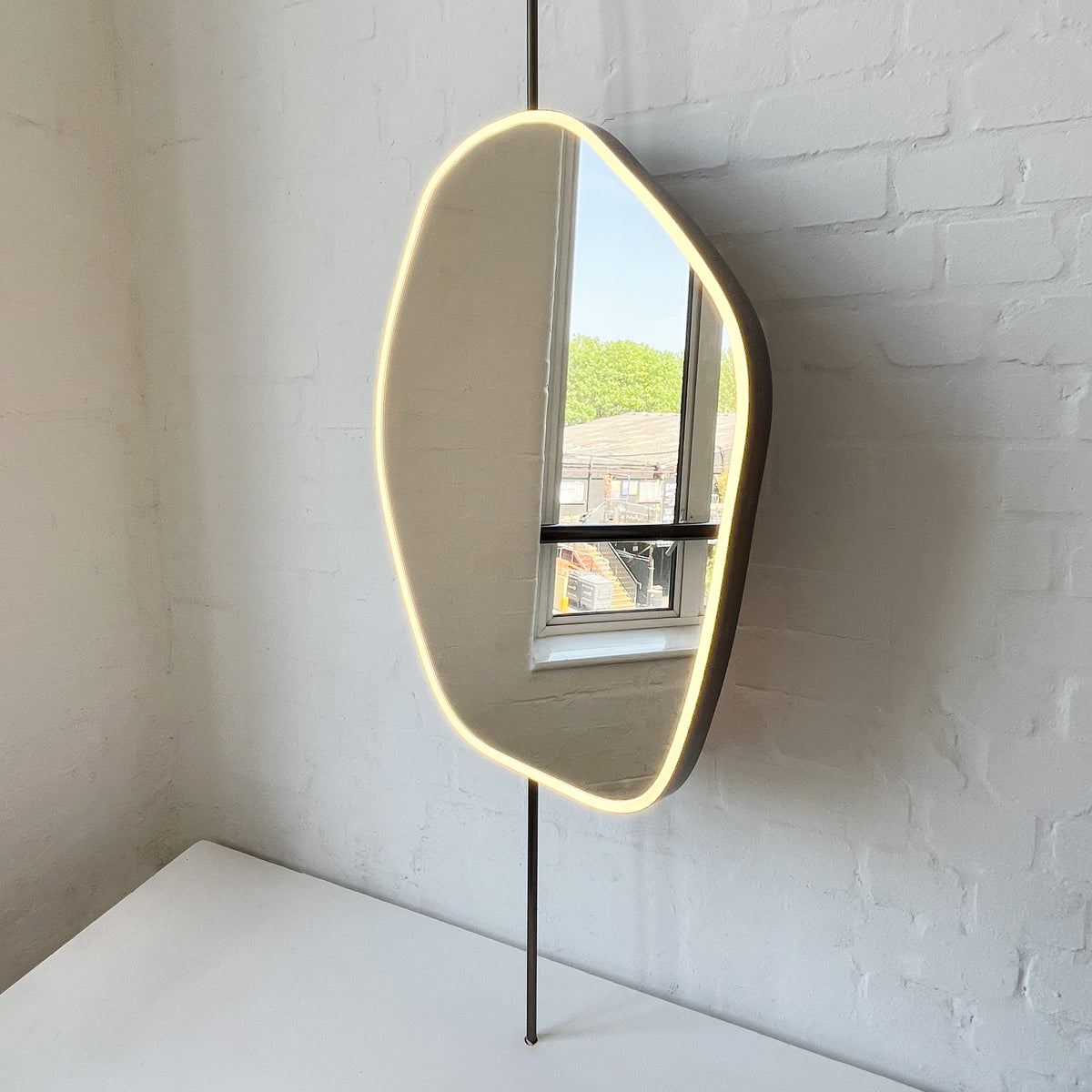 Countertop to Ceiling Freeform Illuminated Mirror with Bronze Patina Brass Frame