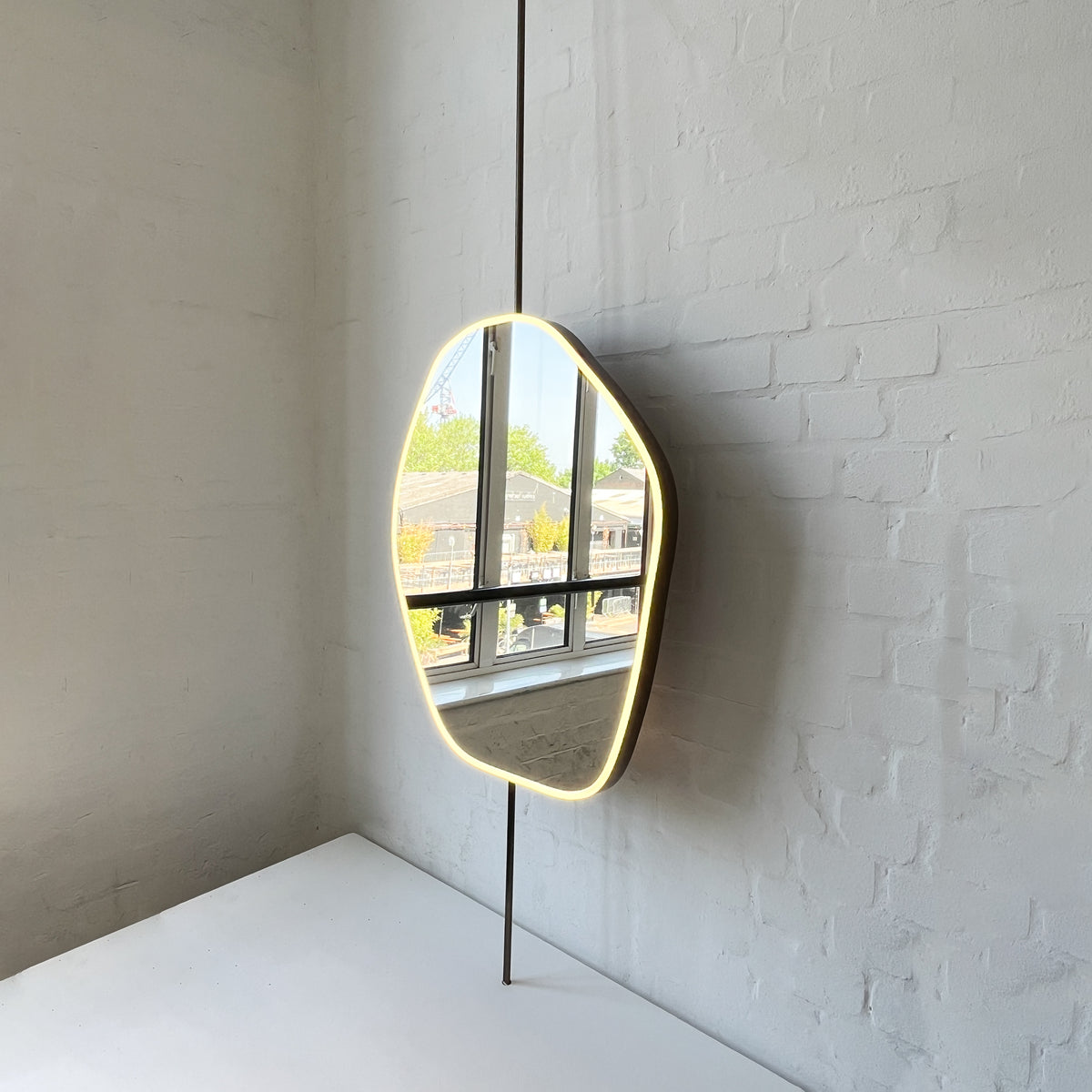 Countertop to Ceiling Freeform Illuminated Mirror with Bronze Patina Brass Frame