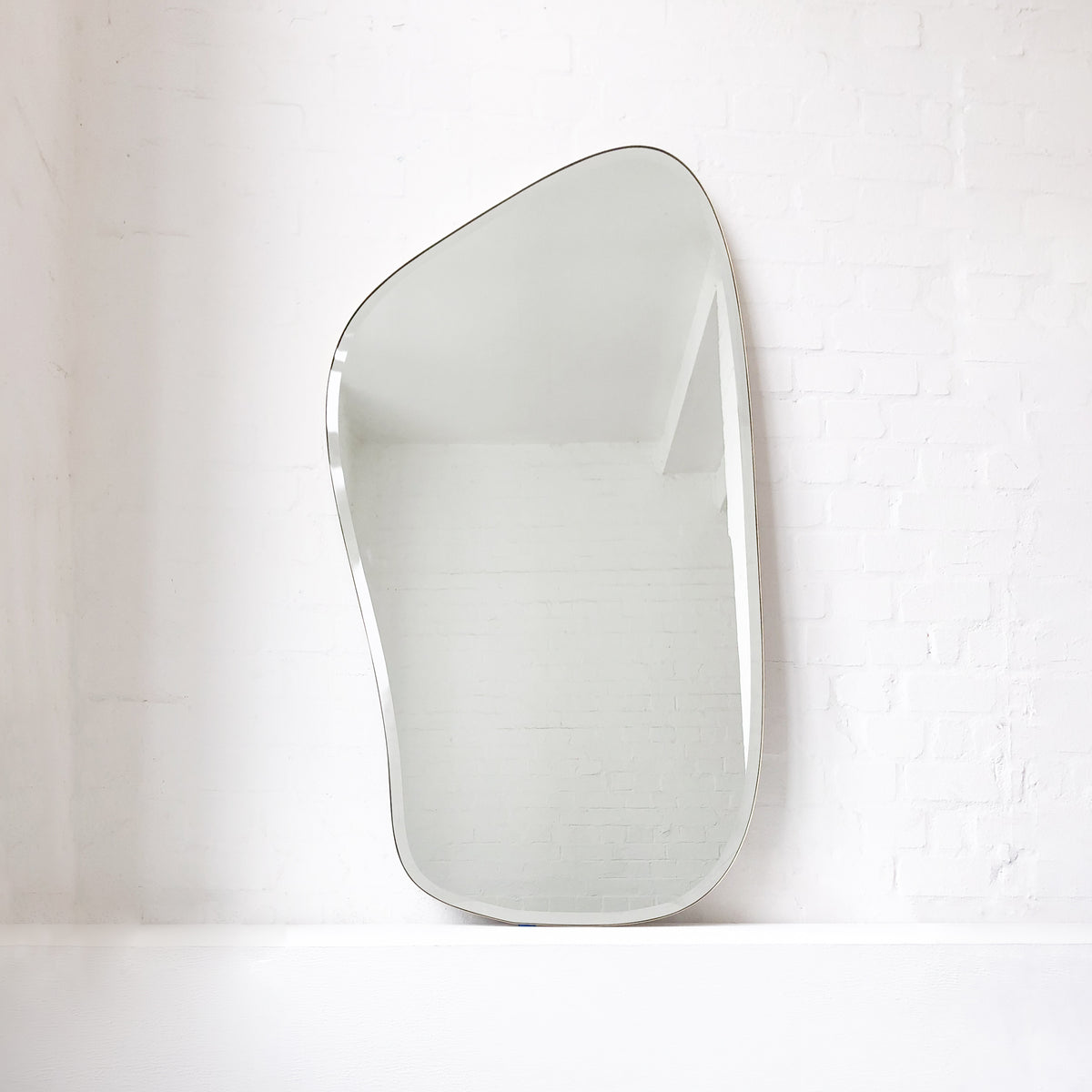 Freeform Bevelled Mirror with Minimalist Brass Frame