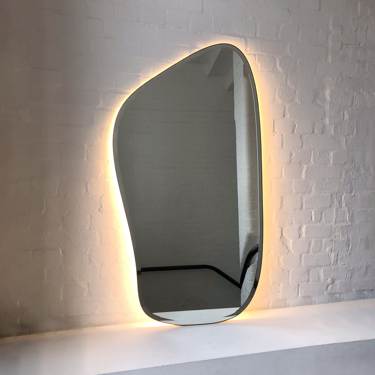 Freeform Bevelled Illuminated Mirror with Minimalist Brass Frame