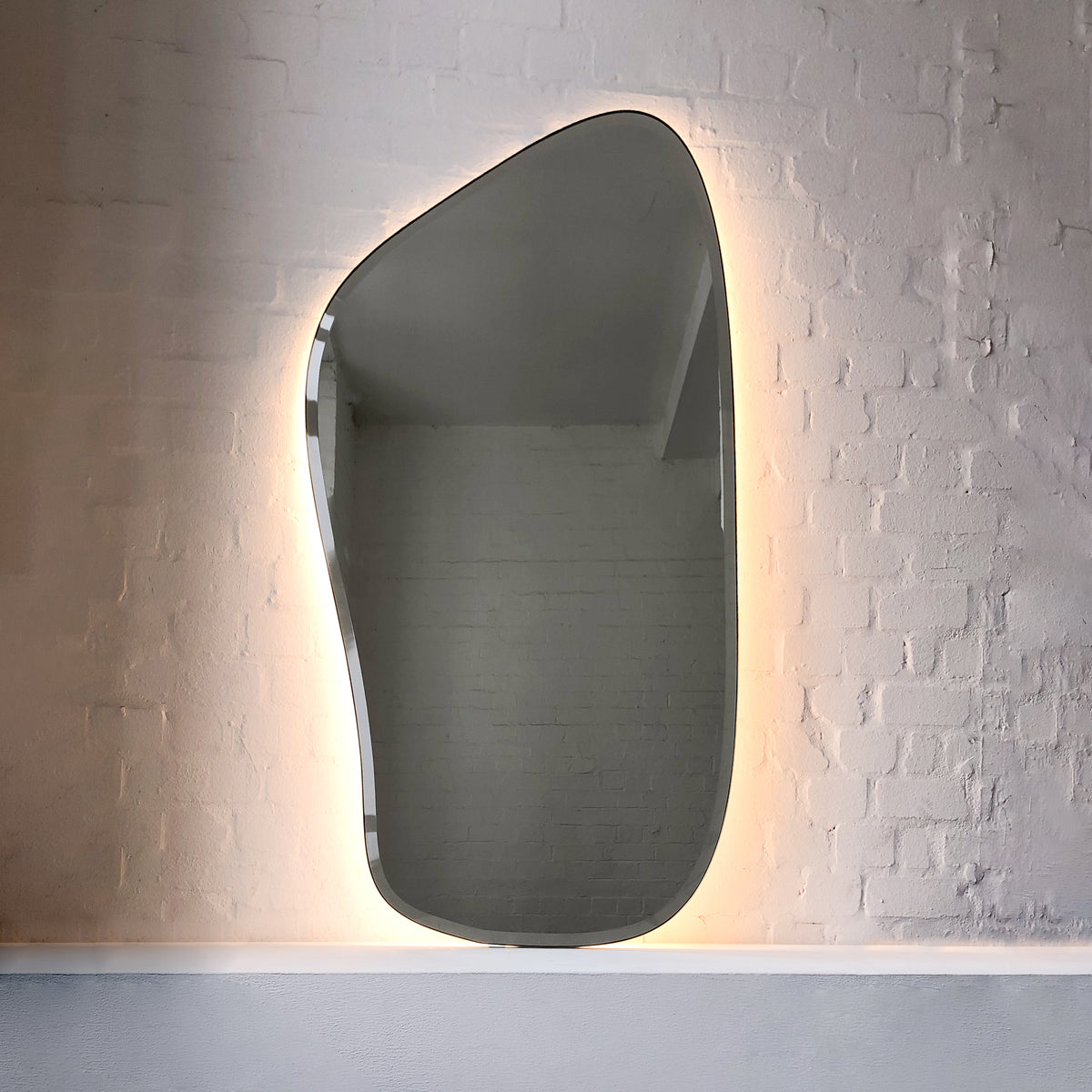 Freeform Illuminated Bevelled Mirror with Minimalist Brass Frame