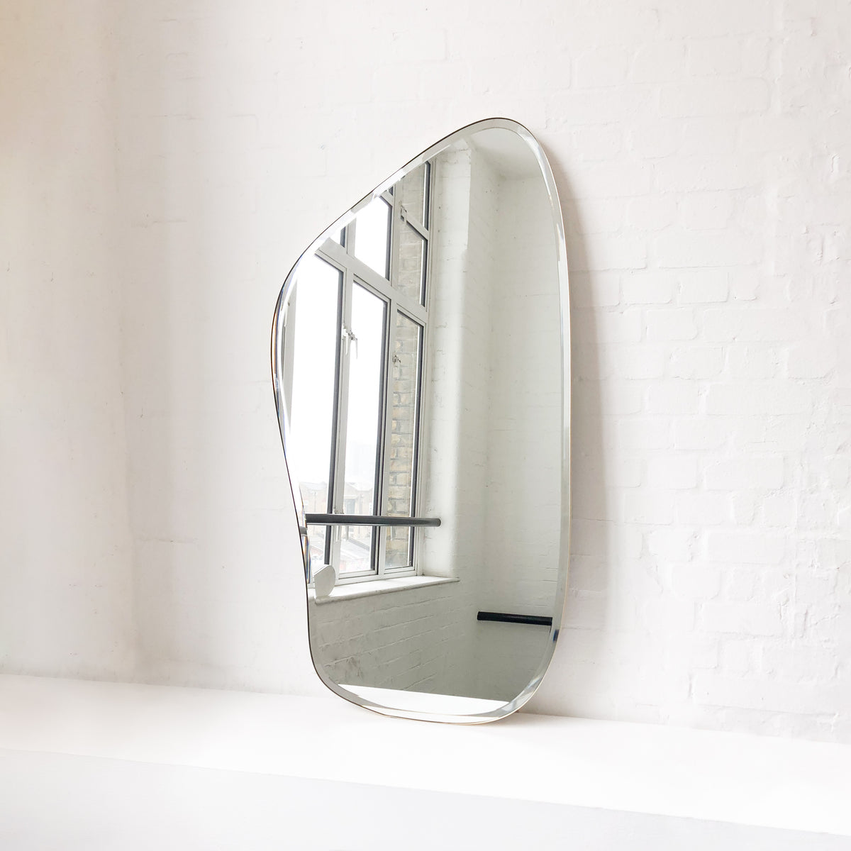 Freeform Bevelled Mirror with Minimalist Brass Frame