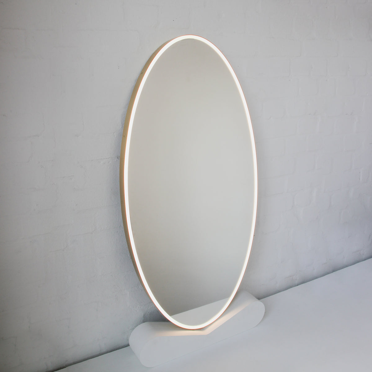 Ovalis™ Oval shaped Front Illuminated Modern Large Mirror with a Brushed Brass Frame