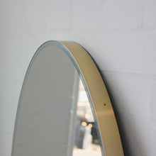 Ovalis™ Oval shaped Front Illuminated Modern Large Mirror with a Brushed Brass Frame