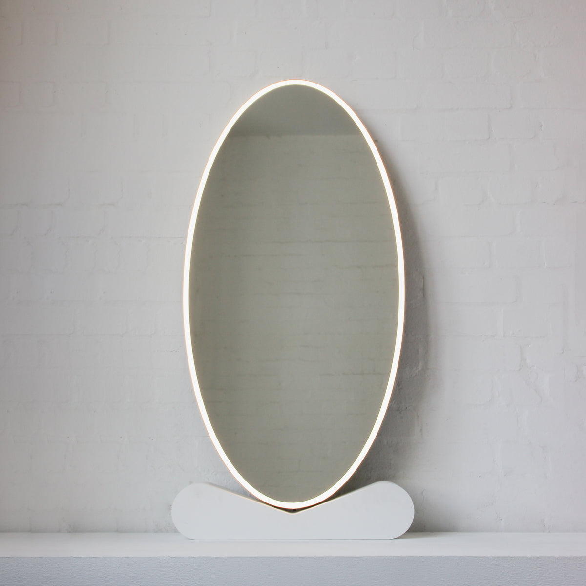 Ovalis™ Oval shaped Front Illuminated Modern Large Mirror with a Brushed Brass Frame