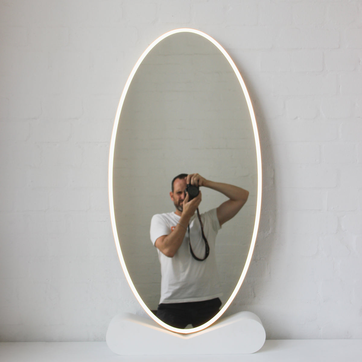 Ovalis™ Oval shaped Front Illuminated Modern Large Mirror with a Brushed Brass Frame