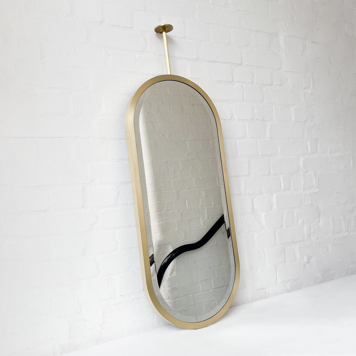 Pill shaped Ceiling Suspended Bevelled Mirror with Brass Full Frame