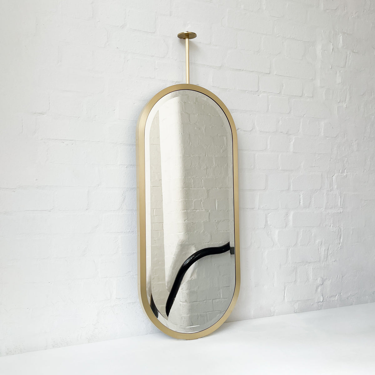 Pill shaped Ceiling Suspended Bevelled Mirror with Brass Full Frame