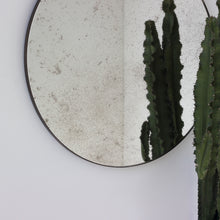 Orbis™ Antiqued Round Mirror with a Handcrafted Bronze Patina Frame
