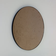 Orbis™ Antiqued Bronze Tinted Round Elegant Mirror with a Black Frame