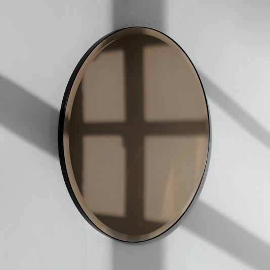In Stock Orbis™ Bevelled Bronze Tinted Round Mirror with a Black Metal Frame