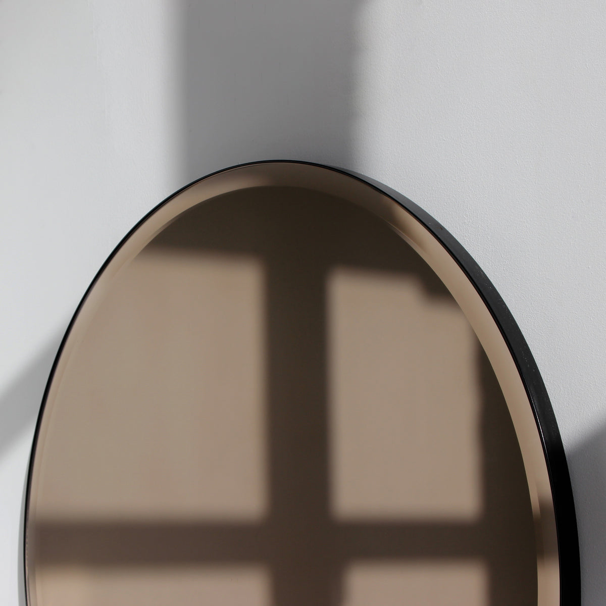 Orbis™ Bevelled Bronze Tinted Decorative Round Mirror with a Black Metal Frame