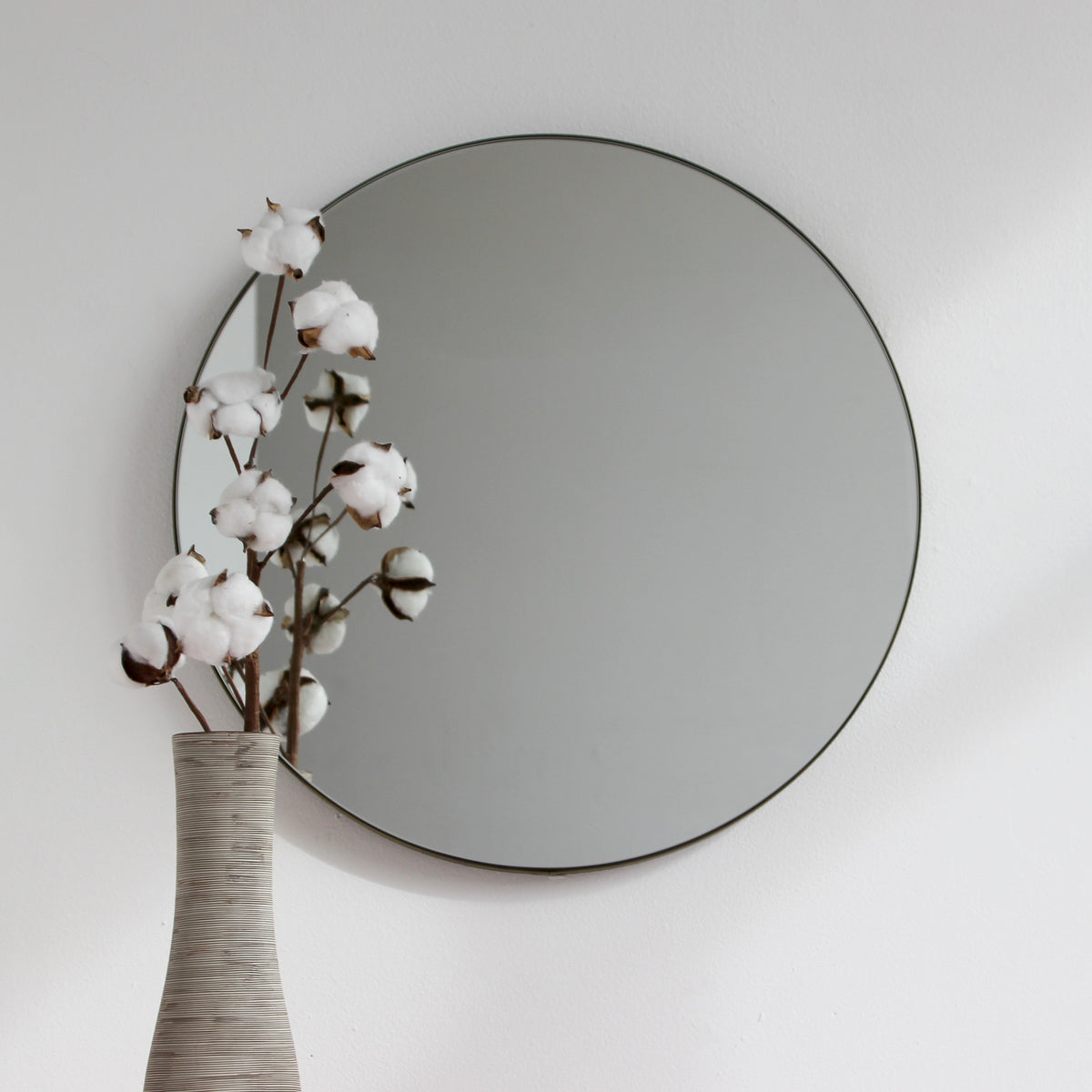 Orbis™ Round Mirror with a Minimalist Handcrafted Bronze Patina Frame