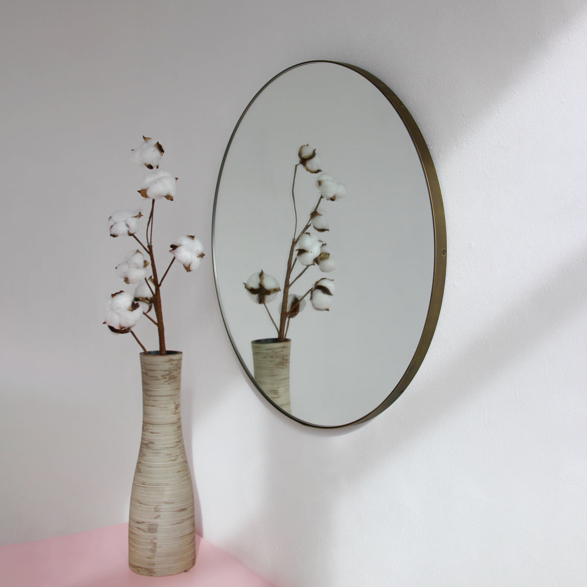 Orbis™ Round Mirror with a Minimalist Handcrafted Bronze Patina Frame
