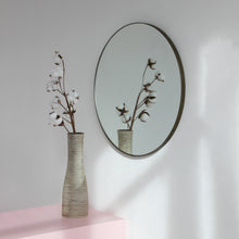 Orbis™ Round Mirror with a Minimalist Handcrafted Bronze Patina Frame