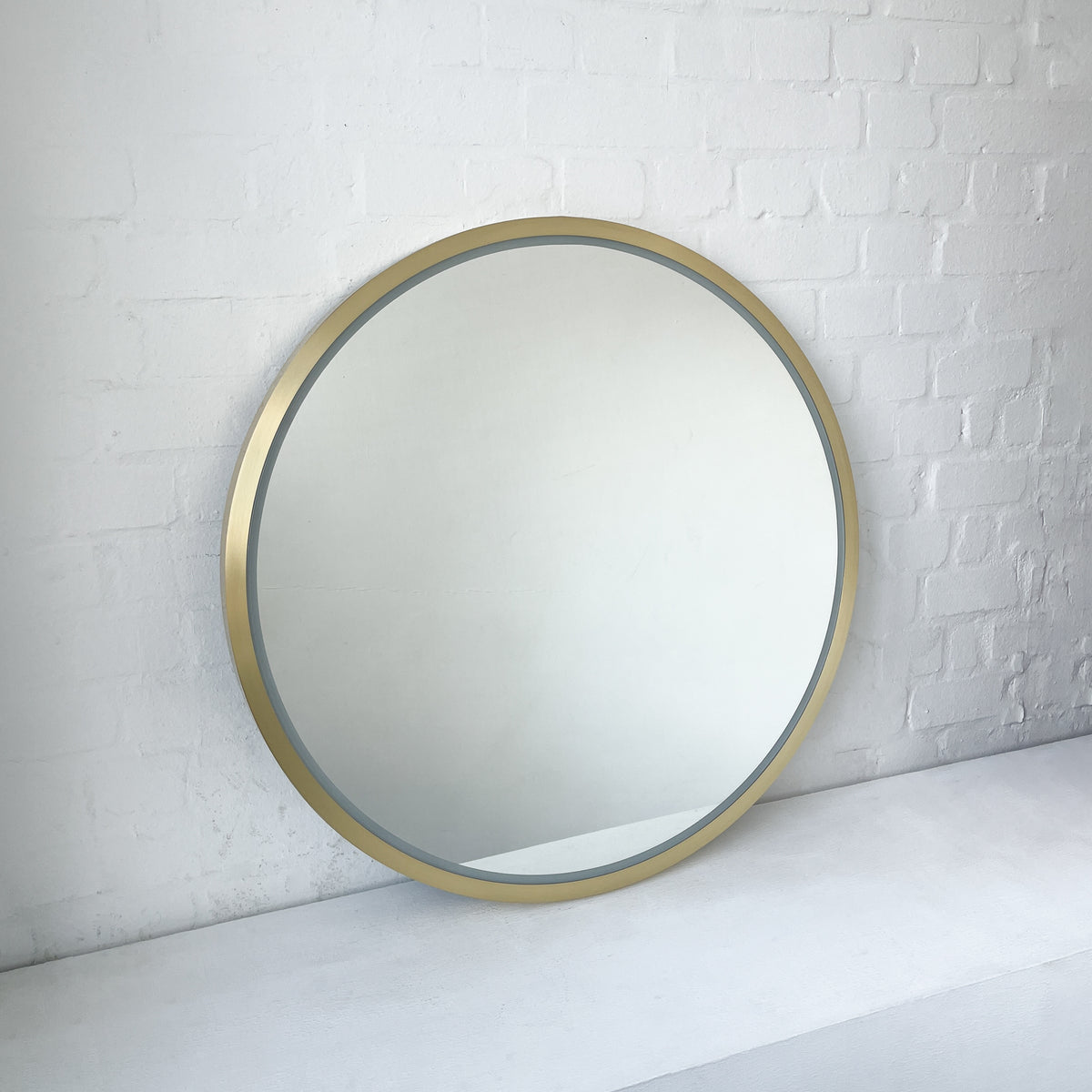 Front Illuminated Orbis™ Round Mirror with Handcrafted Brass Full Frame