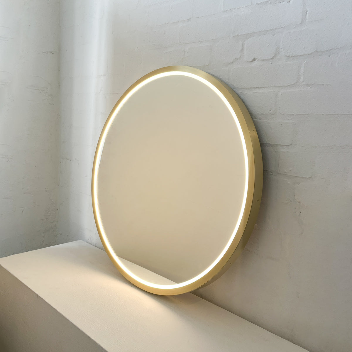 Front Illuminated Orbis™ Round Mirror with Handcrafted Brass Full Frame