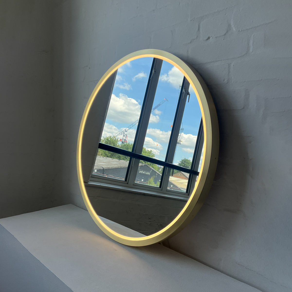 Front Illuminated Orbis™ Round Mirror with Handcrafted Brass Full Frame