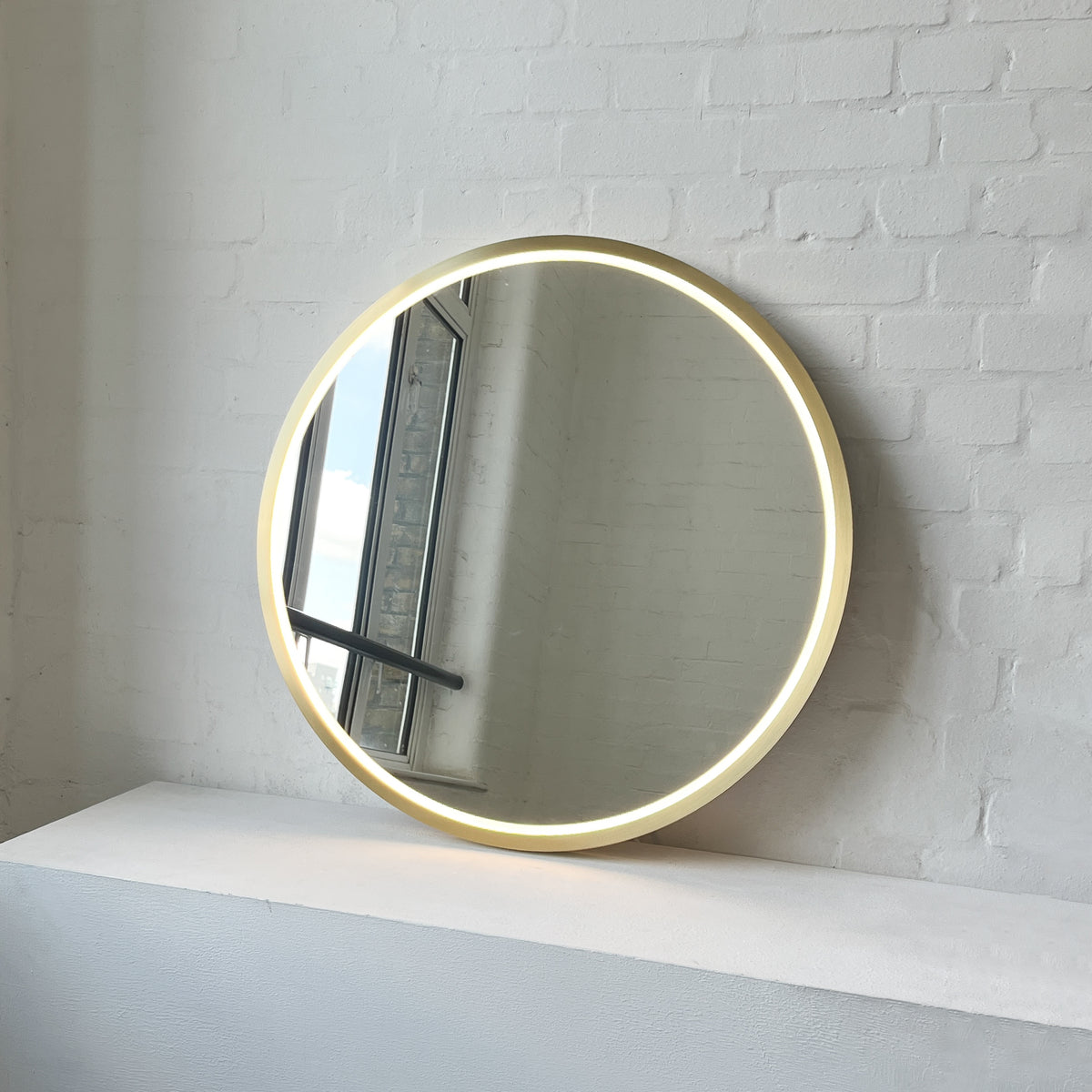 Front Illuminated Orbis™ Round Mirror with Handcrafted Brass Full Frame