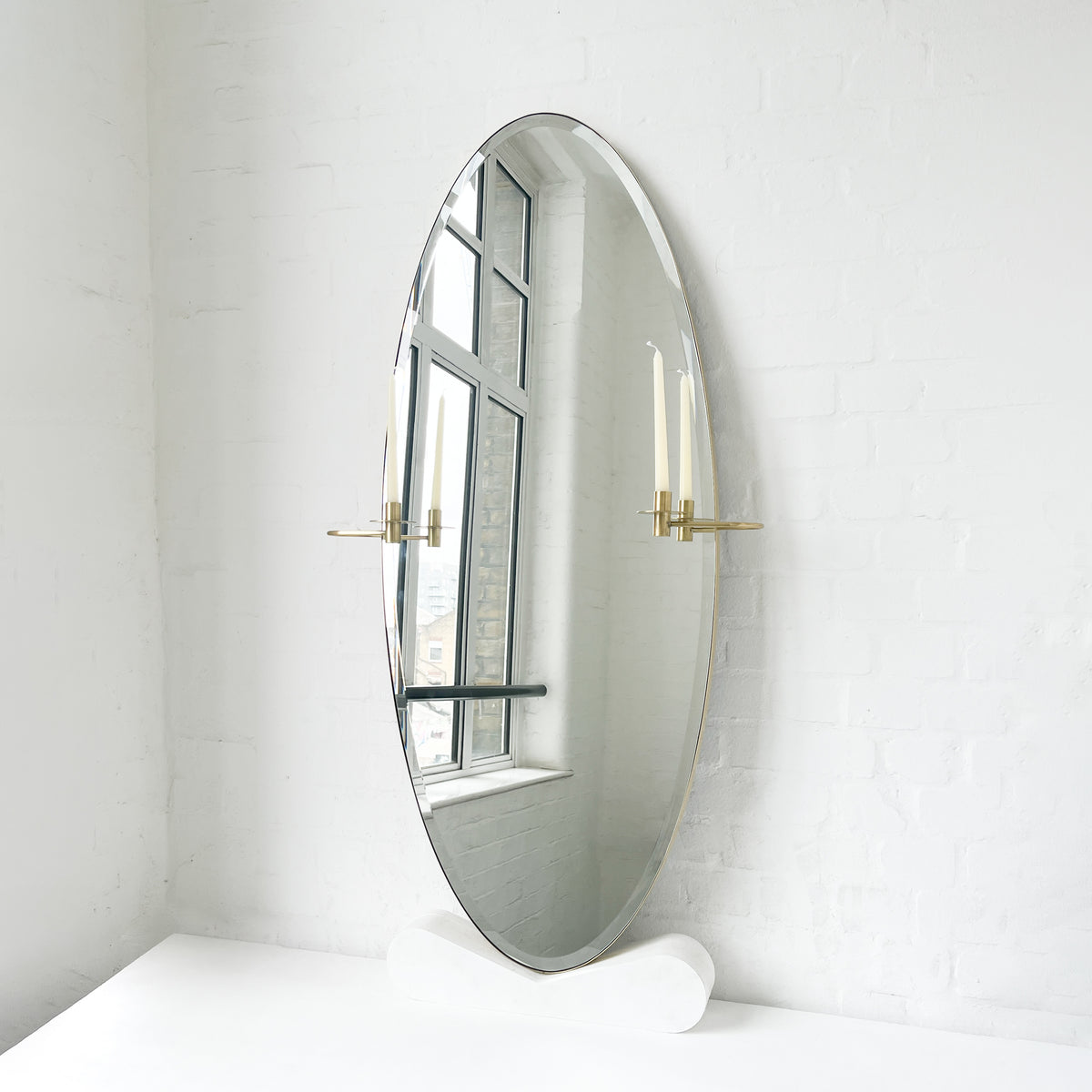 Oval shaped Bevelled Mirror with a Brushed Brass Frame