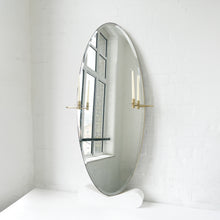 Oval shaped Bevelled Mirror with a Brushed Brass Frame