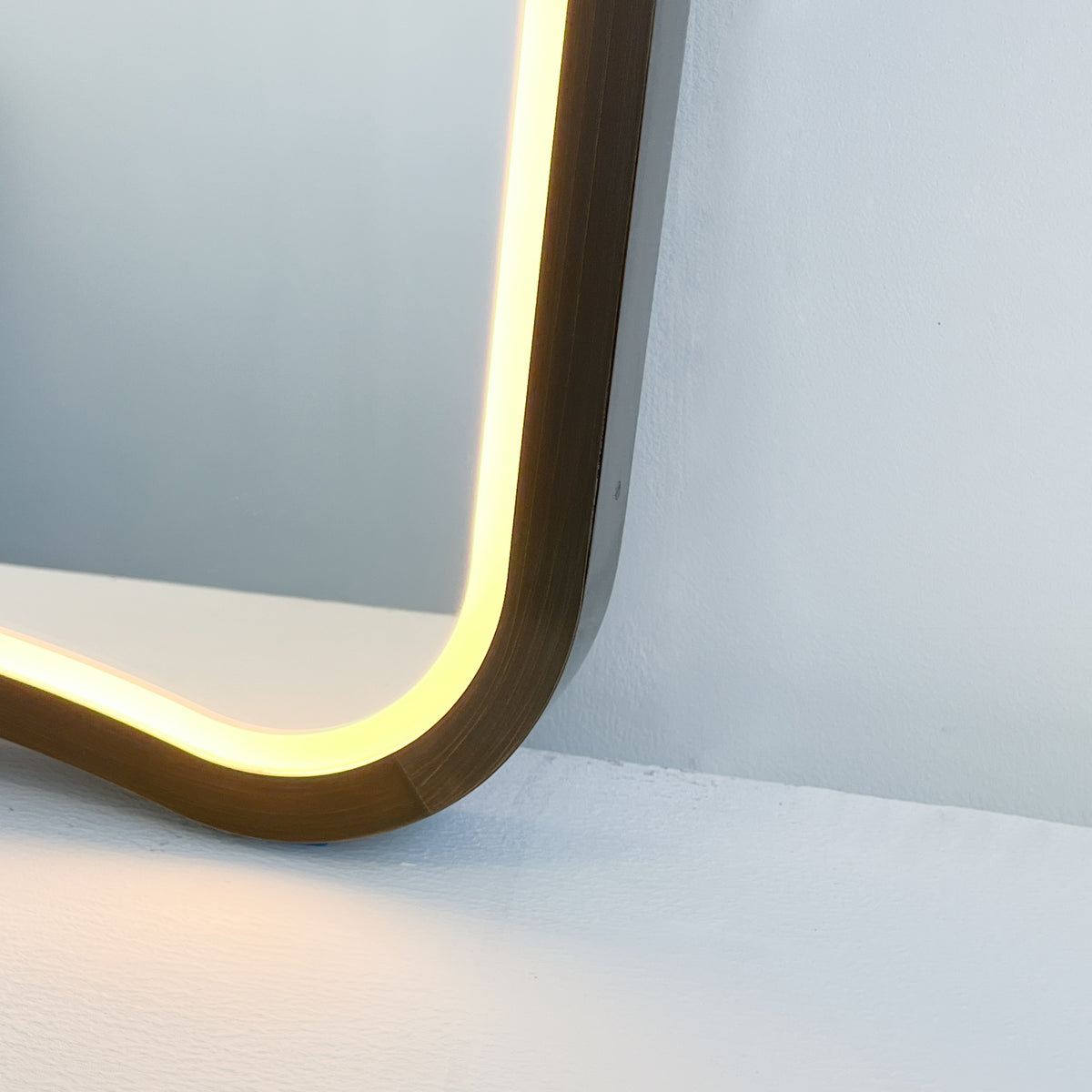 Mid-century inspired Wall Mirror with Front Illumination and Bronze Patina Frame